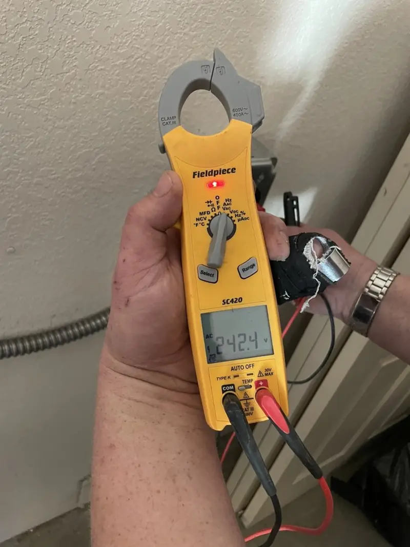 Voltage testing with clamp meter during Generator Installation in Chino Hills